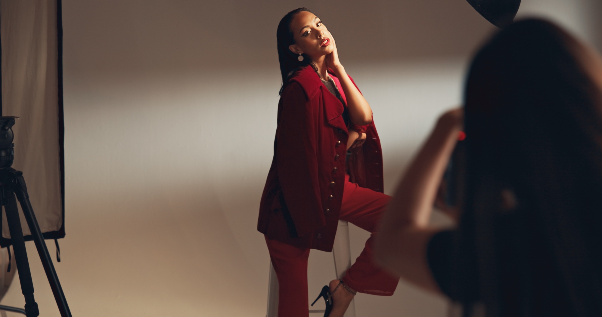 Woman, model and photoshoot for fashion in studio of media photography, clothes brand and backstage